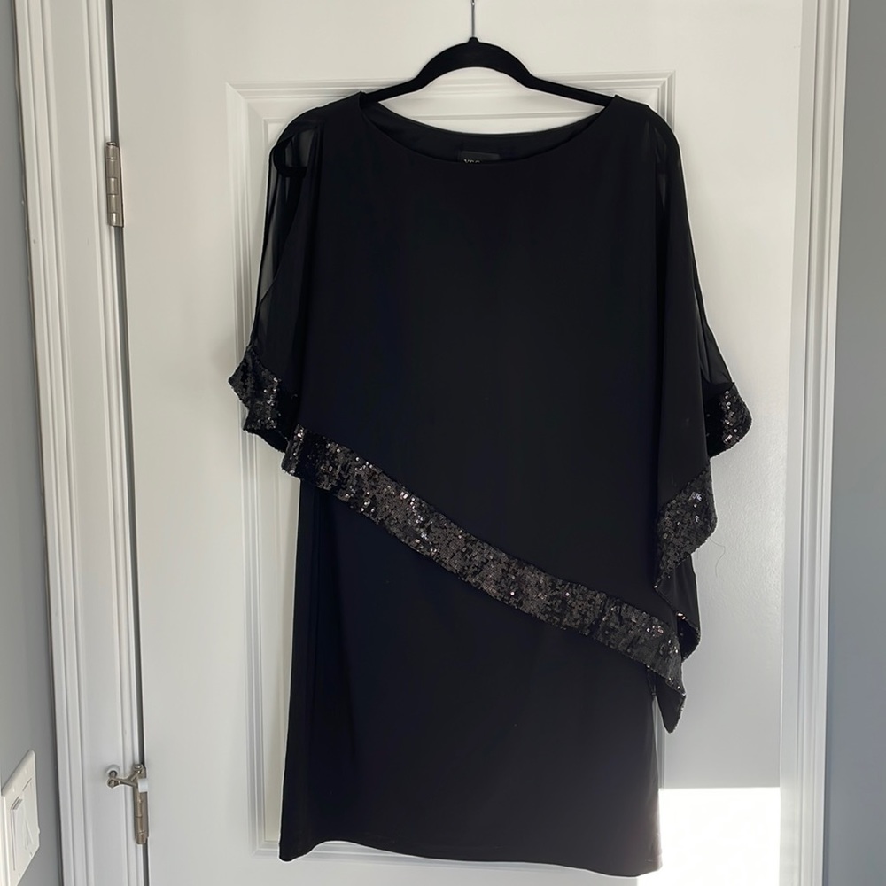 Black dress with sheer overlay and sequence. Wore twice. Like new condition.